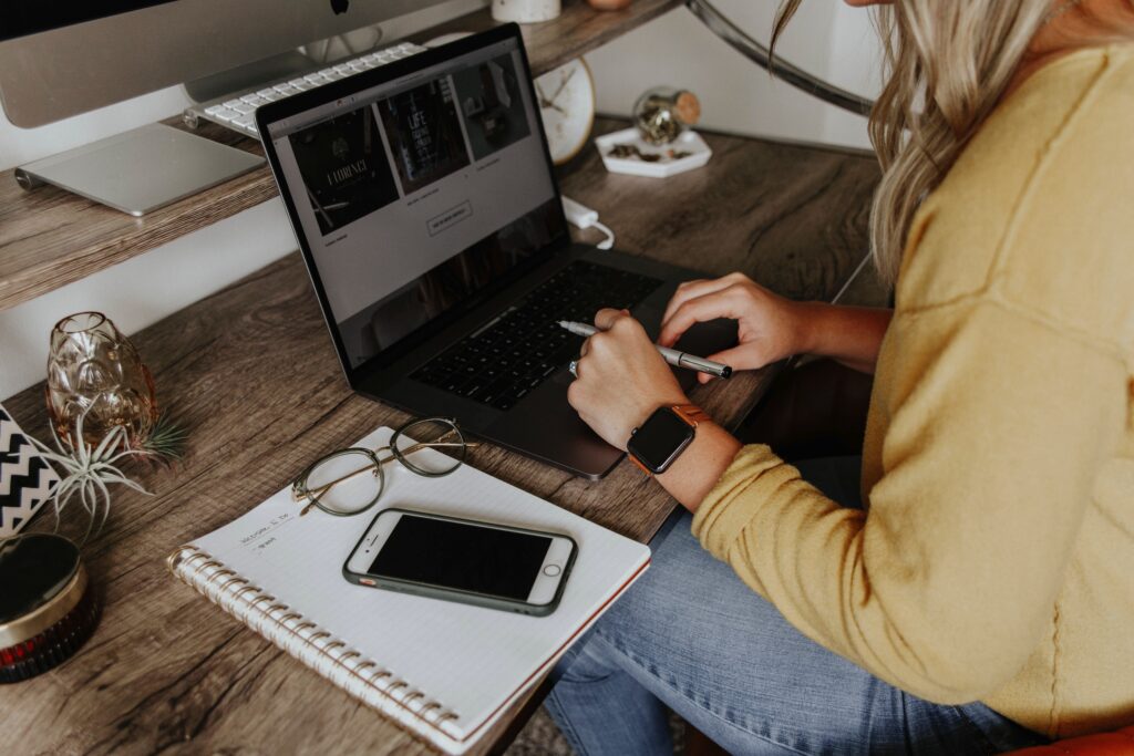 Entrepreneurial woman engaged in affiliate marketing and blogging, meticulously reviewing software and Amazon products on her laptop, set in a home office environment, symbolizing the potential for making money online